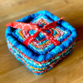 free pattern, Locker Hooked Basket and set of coasters in multi colored fabric strips on 3.75 Mesh Canvas.