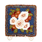 Locker hooked winter bouquet garden panel kit on gold easel.