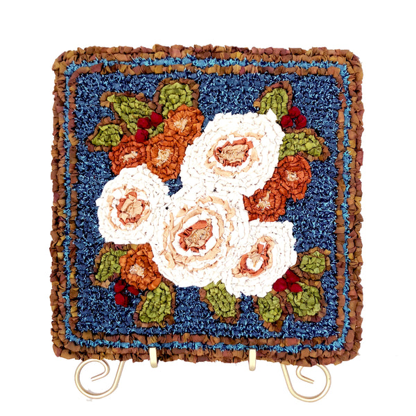 Locker hooked winter bouquet garden panel kit on gold easel.